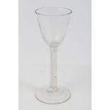Georgian cordial glass with rounded funnel bowl and double air twist stem on splayed foot,