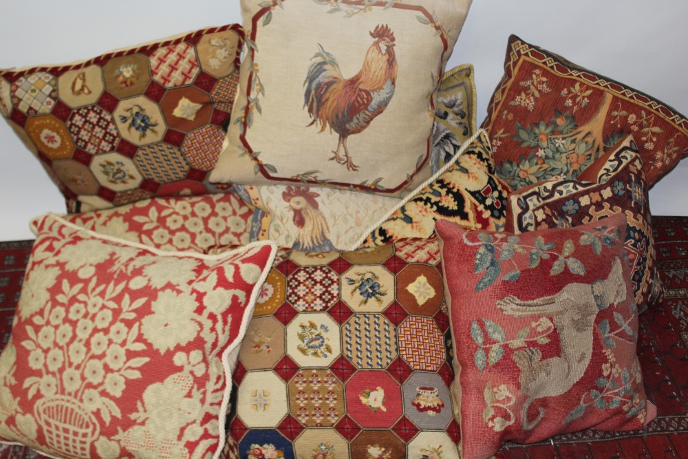 Selection of vintage and contemporary needlework and tapestry cushions - some with feather stuffing,