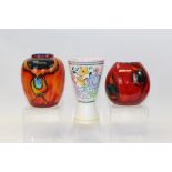 Two Poole Delphis vases and one other Poole Pottery vase with floral decoration (3)