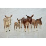 Four Beswick Donkeys - including one Donkey foal