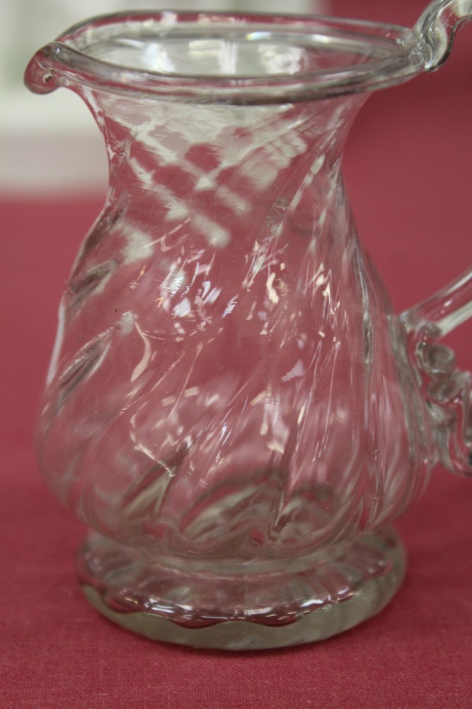 Two Georgian glass cream jugs with spiral-twist decoration, fold-over rims and loop handles, 8. - Image 5 of 16