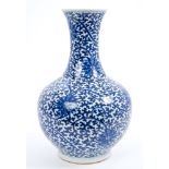 19th century Chinese export blue and white porcelain bottle vase with flared neck and floral scroll