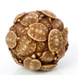 Late 19th century Japanese carved and stained ivory ball,