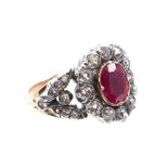 Georgian-style ruby and diamond cluster ring with an oval mixed cut ruby estimated to weigh