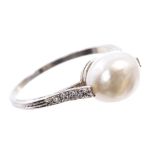 Natural pearl and diamond ring with a natural salt water pearl weighing approximately 3.