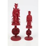 Two mid-19th century Chinese red-stained ivory chess pieces representing a Queen and Bishop - both