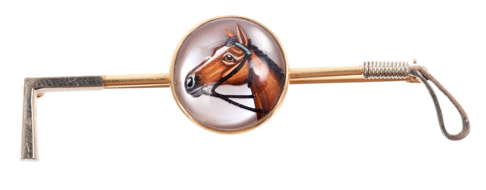 Stick pin in the form of a riding crop, with an Essex crystal cabochon painted with a horse's head,
