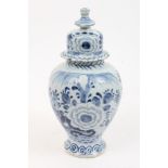 Mid-18th century Dutch Delft blue and white tin glazed pottery vase and cover with painted floral