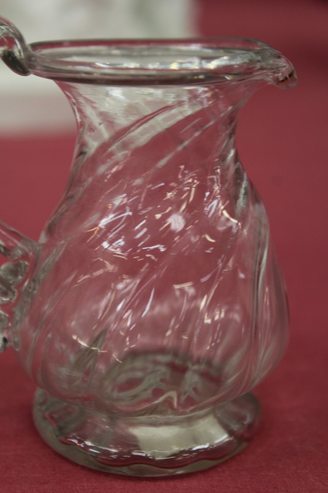 Two Georgian glass cream jugs with spiral-twist decoration, fold-over rims and loop handles, 8. - Image 7 of 16