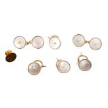 Five mother of pearl dress studs, stamped - 9ct and 18ct,