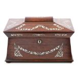 Regency rosewood sarcophagus-shaped tea caddy with mother of pearl floral swag inlaid decoration,