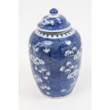 Late 19th century Chinese blue and white baluster vase and cover with painted prunus on cracked ice