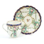 18th century Worcester fluted coffee cup and saucer with painted floral swags and fruit with blue