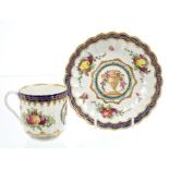 18th century Worcester fluted coffee cup and saucer with polychrome painted urns, flowers,