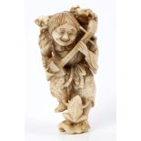 Late 19th century Japanese carved ivory figure of a musician with frogs, 6.