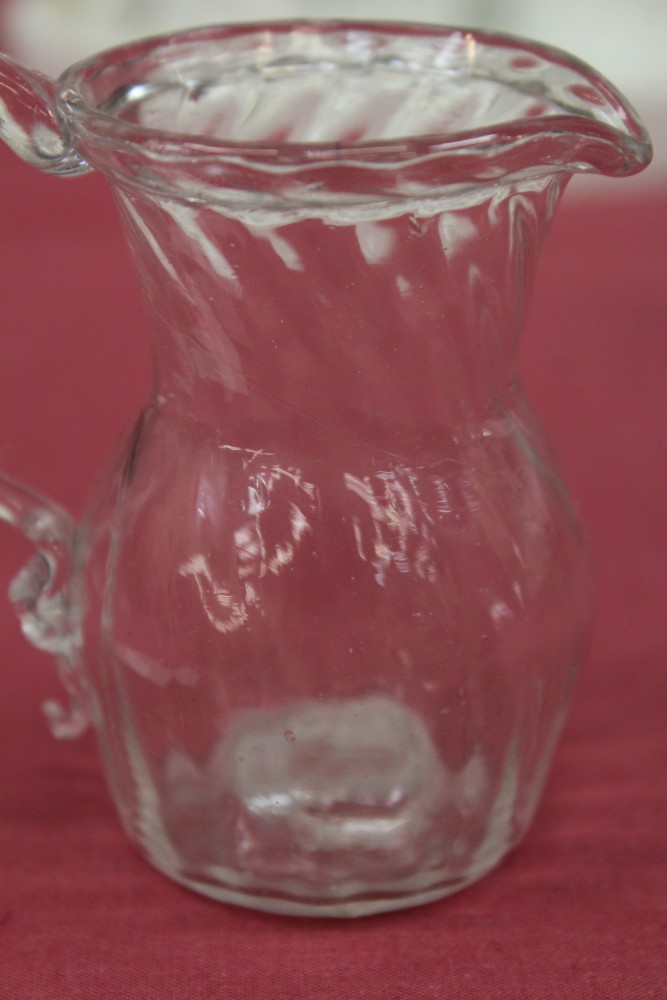 Two Georgian glass cream jugs with spiral-twist decoration, fold-over rims and loop handles, 8. - Image 13 of 16