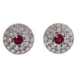 Pair ruby and diamond earrings with a circular target-shaped cluster,