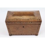 George IV parquetry banded walnut tea caddy of sarcophagus form, with two lidded compartments,