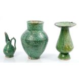 Three early Islamic green glazed pottery vessels,