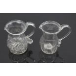 Two Georgian glass cream jugs with spiral-twist decoration, fold-over rims and loop handles, 8.