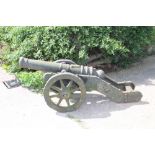 Replica cast cannon on twin-wheeled gun carriage,