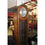 1930s longcase clock with circular dial in domed oak case,