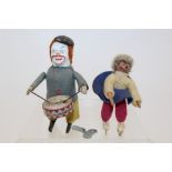 Schuco Clockwork Drummer Clown - with white face and felt clothing with a small girl ice skater