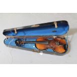 Early 20th century full-size violin with solid back, total length 59cm, together with two bows,