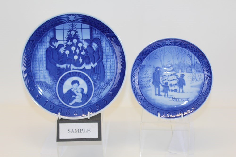 Fifteen Royal Copenhagen Christmas plates and one other larger plate