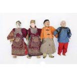 Dolls - two Chinese composite and wood dolls in matching silk dragon robes,