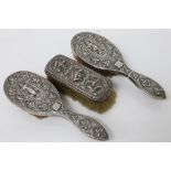 Vintage silver dressing table brush set - comprising of three brushes with embossed Asian dancers