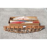 Selection of constructed and partially constructed wooden models of boats,