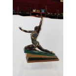 Art Deco-style bronze figure of a female dancer, on a graduated sloping base,