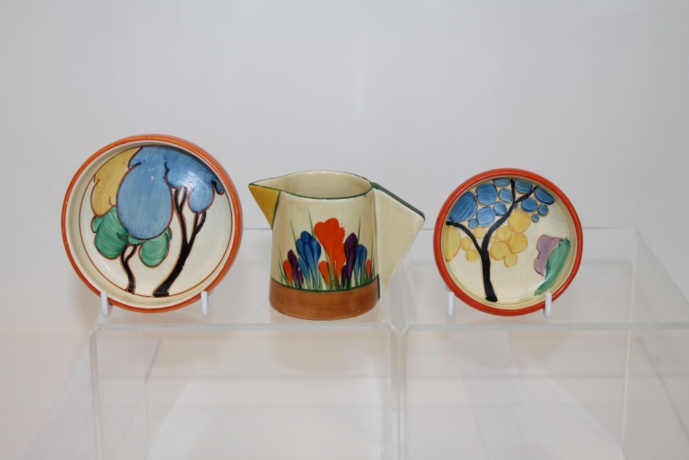 Early 1930s Clarice Cliff Bizarre range Crocus pattern jug and two Clarice Cliff Bizarre range pine