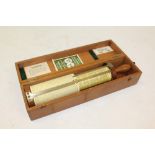 Fuller's Patent spiral slide rule with twin scales and brass pointers,