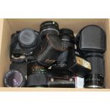 Pentax MU 35mm camera with various lenses and accessories