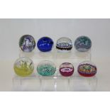 Eight various glass paperweights - including Caithness,