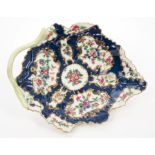 18th century Worcester leaf-shaped dish with painted floral reserves within gilt cartouches on blue