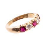 Ruby and diamond five stone ring with three round mixed cut rubies and two brilliant cut diamonds