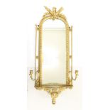 Mid-19th century carved gilt gesso girandole of narrow arched form,