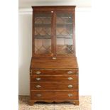 George III mahogany bureau bookcase with moulded cornice and adjustable shelves enclosed by a pair