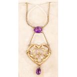 Edwardian amethyst pendant necklace, the openwork heart-shape gold plaque with foliate design,