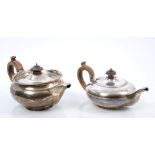 George III silver teapot of compressed baluster form, with flared gadrooned rim,