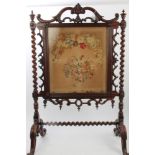 Early Victorian carved rosewood fire screen with rectangular floral tapestry banner with scrolled