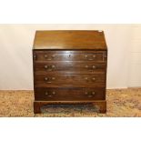 George III mahogany bureau with fitted interior about central cupboard door and four graduated