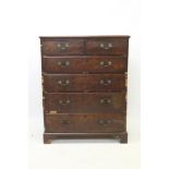 Large George III mahogany chest of two short and four long graduated drawers, on bracket feet,