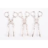 Three pairs of mid-18th century silver sugar nips with scissor-action,