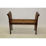 Regency-style polychrome painted mahogany window seat with scrolled double caned sides and caned