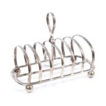 Early George V silver six-division toast rack of hooped form, with central carrying handle,