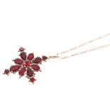 George III garnet cluster pendant / brooch with flat cut foil-backed garnets in a cruciform floral